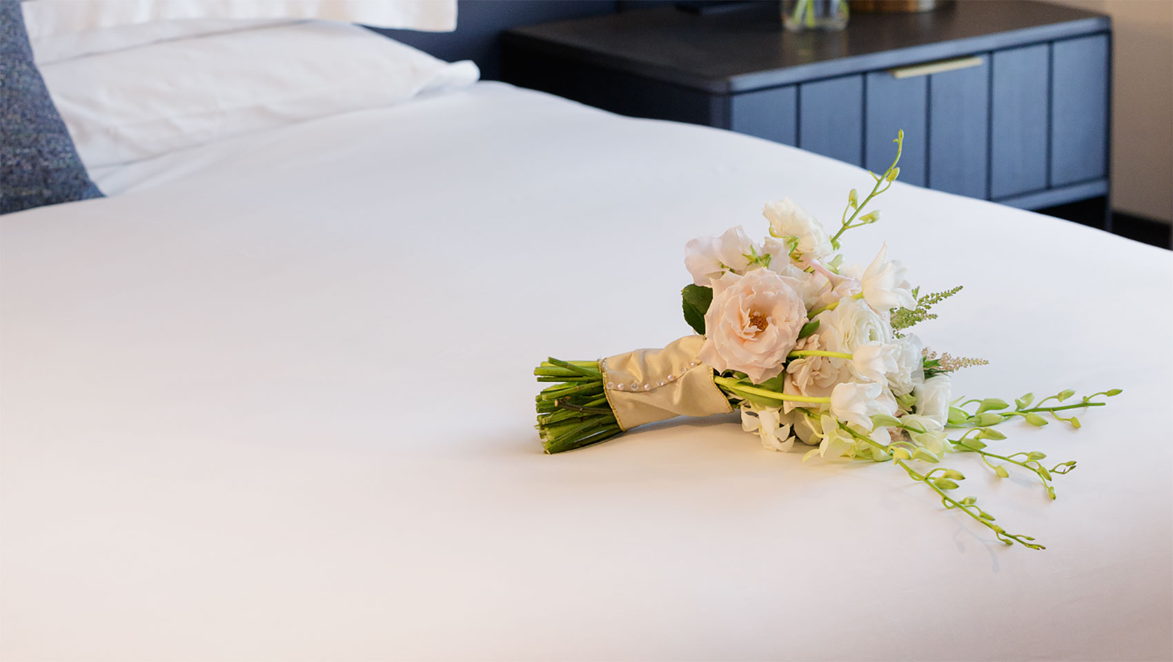 Flower bouquet on bed