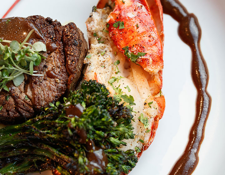 A surf and turf meal, consisting of lobster and steak